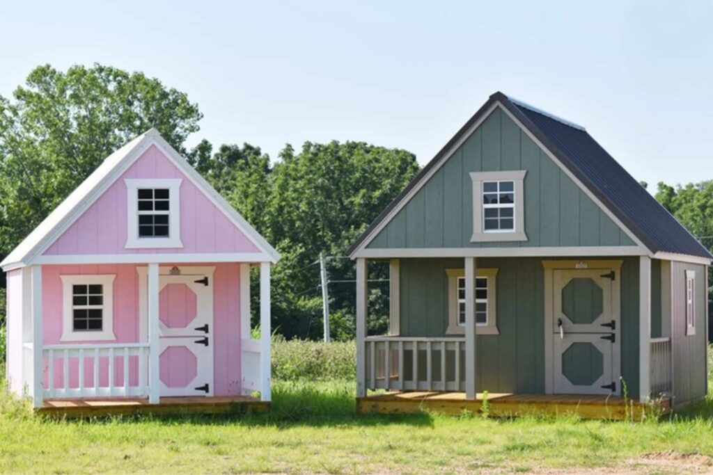 Pink and green backyard playhouses in Waco at RampUp Storage